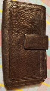 Slightly used Fossil wallet with genuine leather.